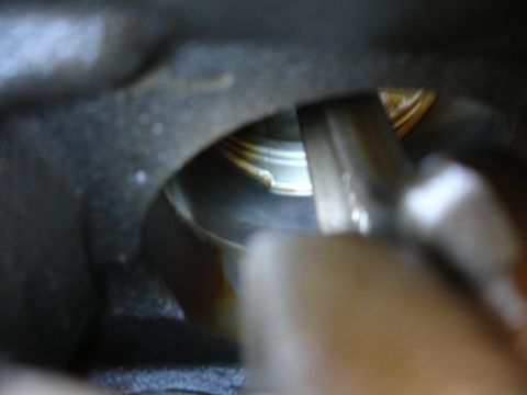 1992 Ford Taurus - A detailed view of the inside of an engine cylinder, showing signs of oil and wear.