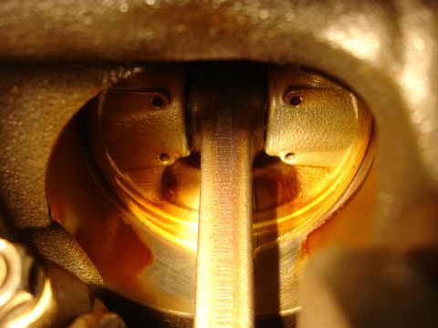 1992 Ford Taurus - Close-up view of an engine's internal components, showing a piston and connecting rod.