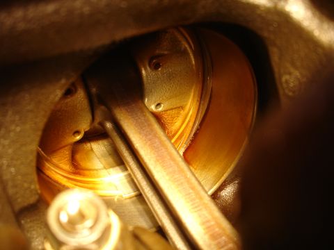 1992 Ford Taurus - Engine piston and connecting rod assembly, likely during a rebuild or inspection, showing internal engine components.
