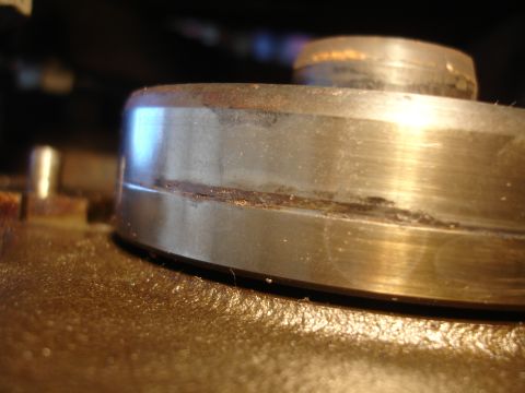 1992 Ford Taurus - A close-up view of a damaged metal bearing, showing signs of wear and corrosion.