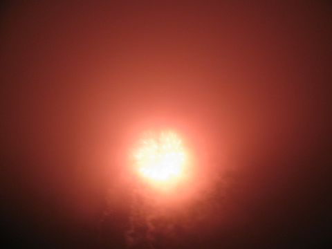 1985 Ford LTD Crown Victoria - A bright burst of fireworks lights up the hazy sky.