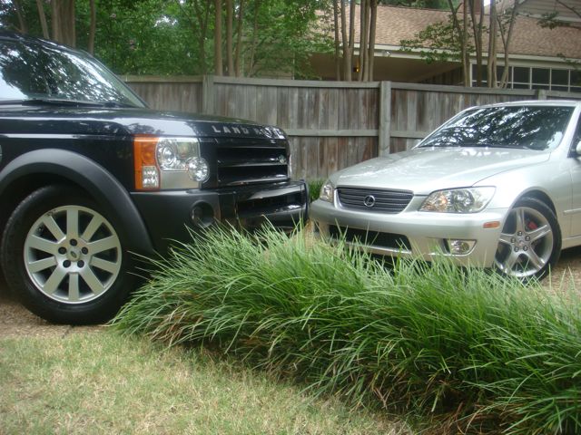 Silver 2001 Lexus IS 300 front 3/4 view next to a black Land Rover