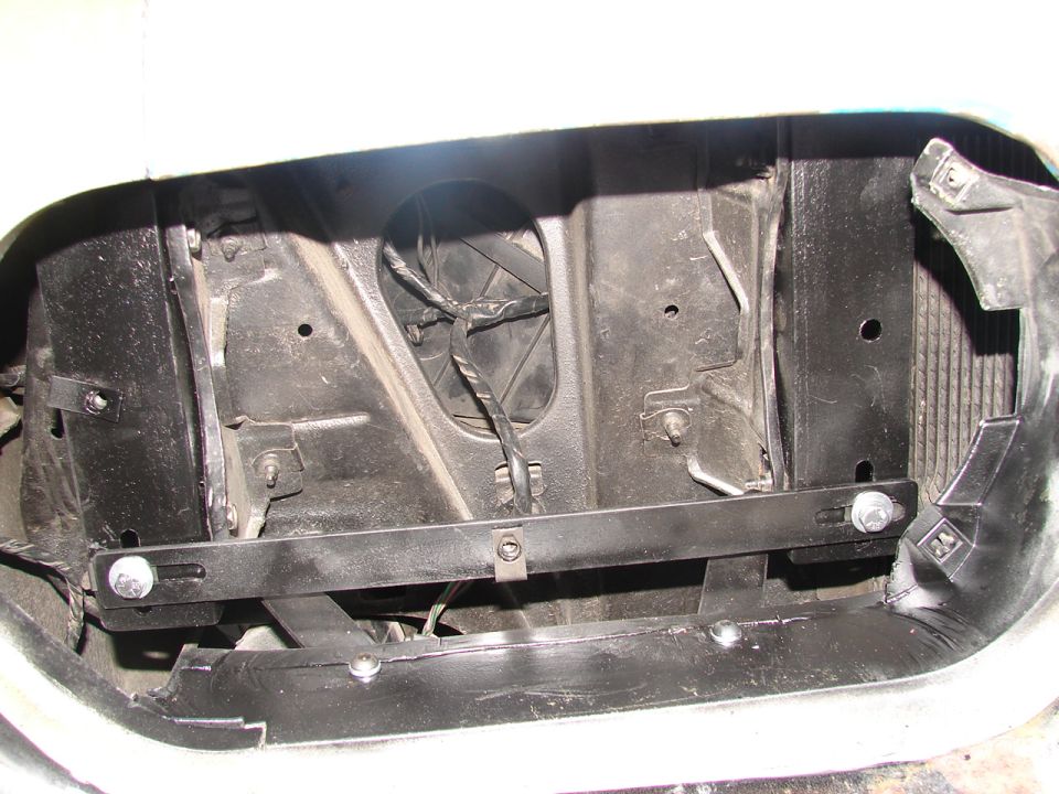 Black core support in an empty front opening with a bolted-in steel crossbar