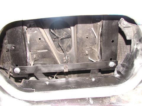 1973 Ford Ranchero - Headlight housing interior showing wiring and a metal support bracket.