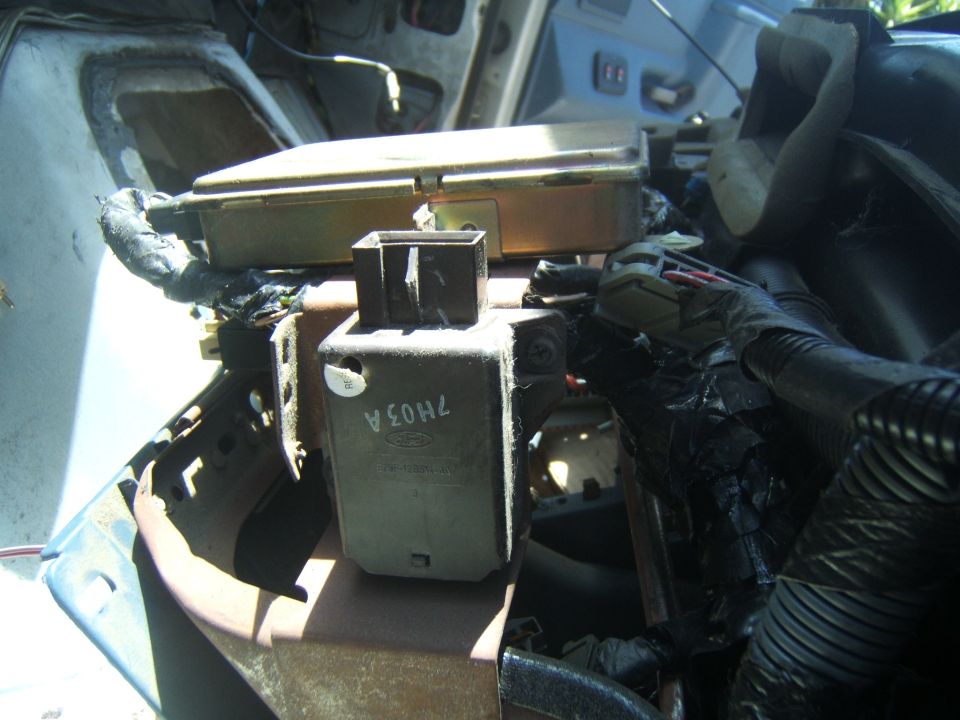 Interior electronics and wiring with Ford part 7H03A visible