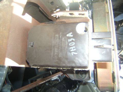 1988 Ford Bronco - Close-up of an electronic control module, possibly from a vehicle, with visible part numbers.