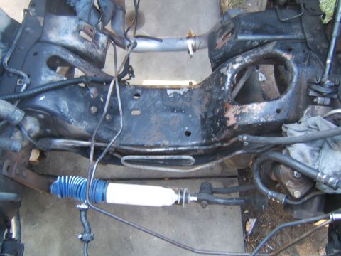 1988 Ford Bronco - The vehicle's frame and steering components are shown, with a new shock absorber installed.