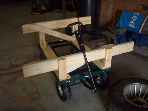 1978 Jeep CJ5 - A wooden frame is mounted on a garden cart, suggesting a custom build or modification.