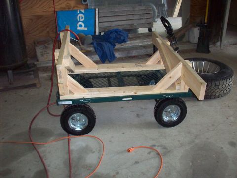 1978 Jeep CJ5 - This homemade cart appears to be constructed from wood and metal, with a spare tire attached.