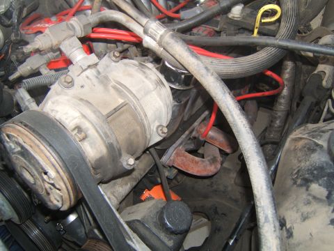1988 Ford Bronco - Close-up view of an engine compartment, showing various engine components and wiring.