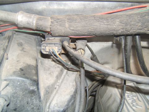 1988 Ford Bronco - Close-up view of the engine compartment wiring harness and associated components.