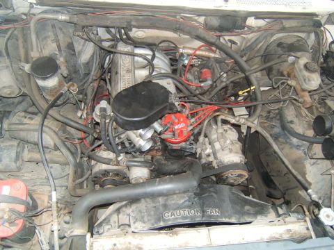 1988 Ford Bronco - Engine bay detail showing MSD ignition and "CAUTION FAN" shroud.