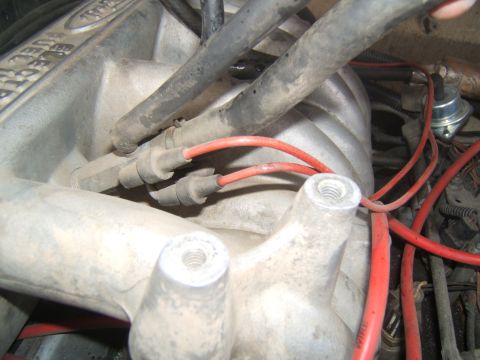 1988 Ford Bronco - Engine intake manifold with spark plug wires and 'ELECTRONIC FUEL INJECTION' text.