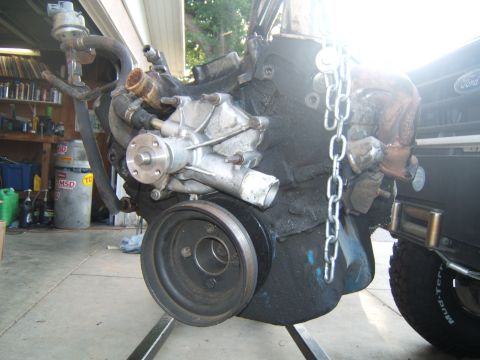 1988 Ford Bronco - Engine block assembly with water pump and pulley, likely for a Ford vehicle.