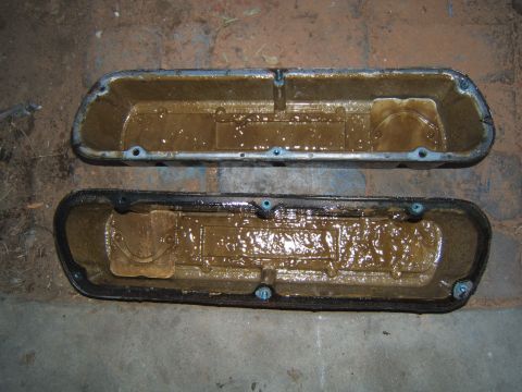 1988 Ford Bronco - These engine valve covers are coated in a thick layer of sludge, indicating potential maintenance issues.