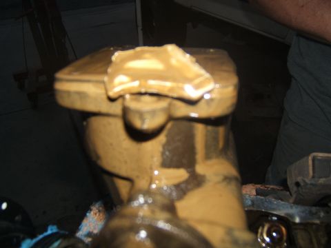 1988 Ford Bronco - Engine part heavily coated in sludge, with a piece broken off the top.