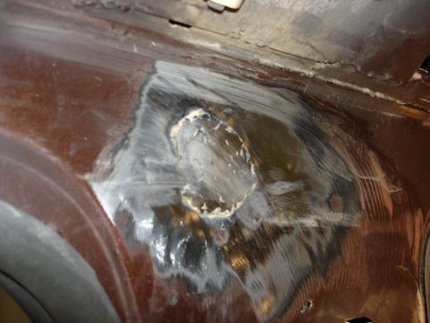 1979 Ford F-250 - Area of metal repair with body filler, likely on a vehicle's body panel.
