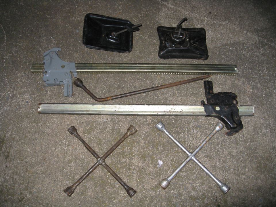various jacks, tire hold downs and four way bars