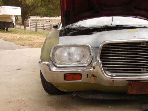 1973 Ford Ranchero - Front view of a 1973 Ford Ranchero, hood up, revealing the engine bay.