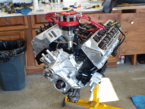 1996 Ford Bronco - Engine on a stand, a red MSD distributor and aluminum valve covers, likely undergoing rebuild.