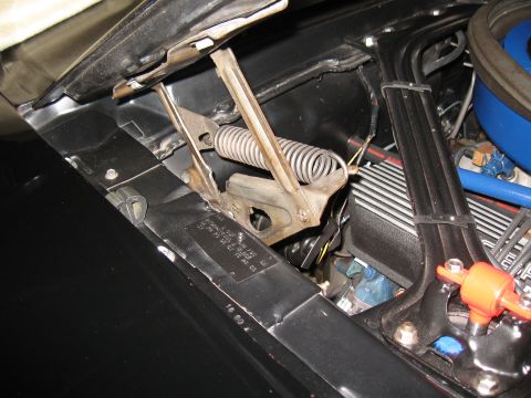 1968 Shelby GT500 - Engine bay detail showing a hood spring and a VIN plate, part of a larger vehicle.