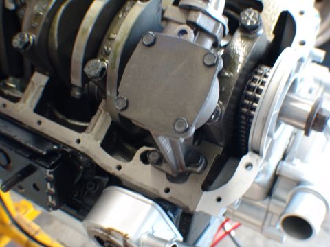 1996 Ford Bronco - Close-up view of an engine's oil pump and crankshaft, showing the timing chain mechanism.