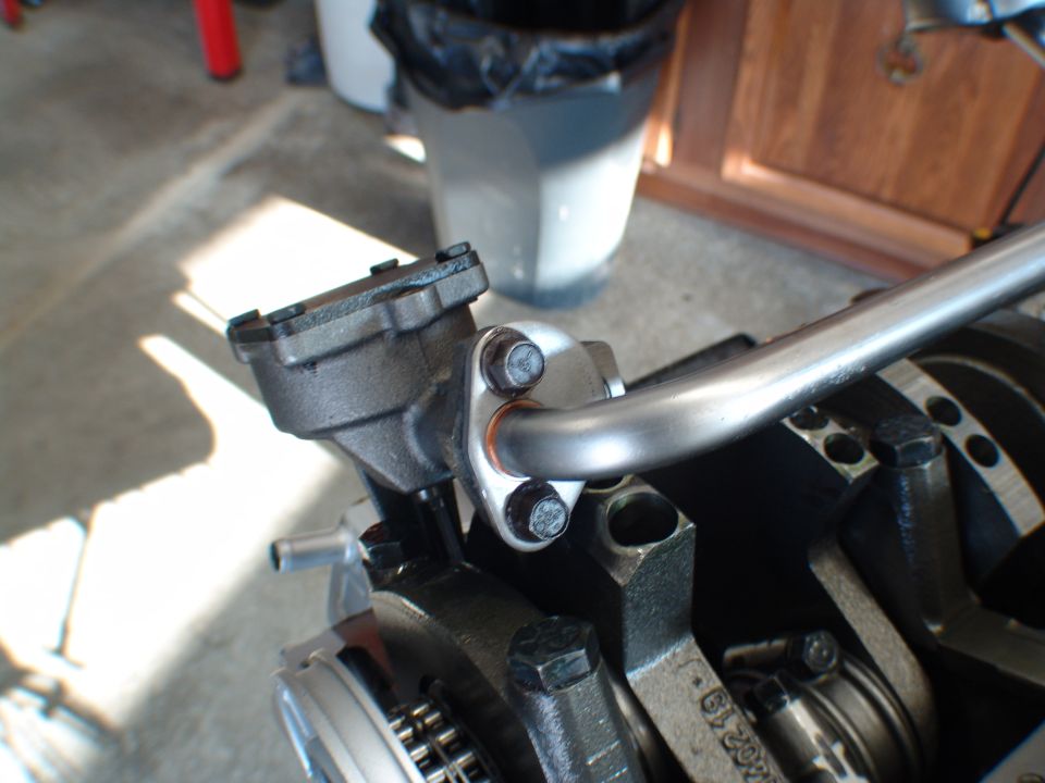 Engine oil pump assembly with pickup tube attached to crankshaft