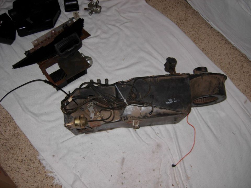 Heater core and blower assembly with wiring, on a white cloth