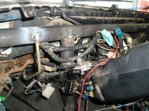 1986 Toyota Hilux - Close-up of the complex wiring system beneath the dashboard of a 1986 Toyota Hilux.