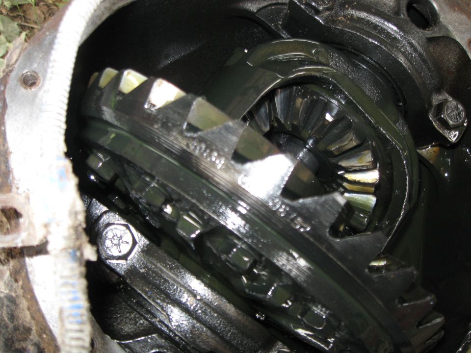Close-up of differential gears with visible part numbers
