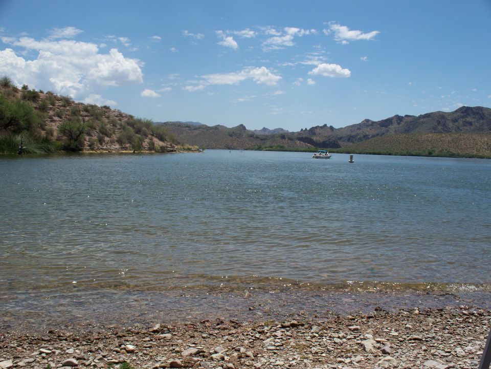 Boat on a lake with mountains in the background