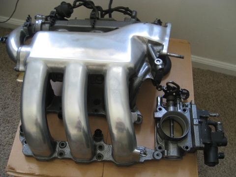 1994 Ford Probe - Engine intake manifold and throttle body assembly shown from a close-up perspective.