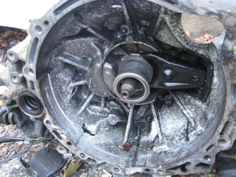 1994 Ford Probe - Close-up of a dirty transmission housing interior, showing internal components and residue.