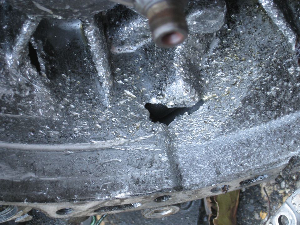 Damaged engine block with a large hole