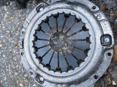 1994 Ford Probe - Close-up of a clutch pressure plate, likely a replacement part.