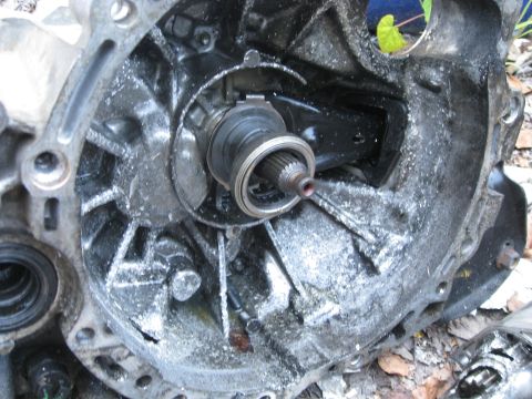 1994 Ford Probe - Close-up view of a dirty transmission bell housing interior.