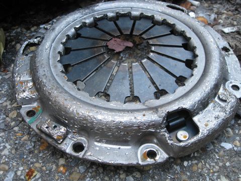 1994 Ford Probe - A worn clutch pressure plate is shown, indicating a need for replacement.