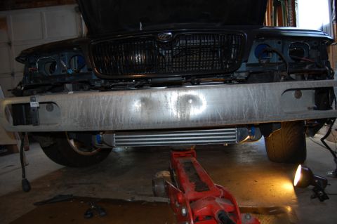 1985 Mercury Grand Marquis - The front of a car is shown with its bumper removed, revealing an intercooler and the grille.