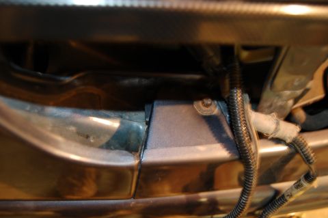 1985 Mercury Grand Marquis - Wiring harness and mounting bracket detail, likely from an engine bay or undercarriage.