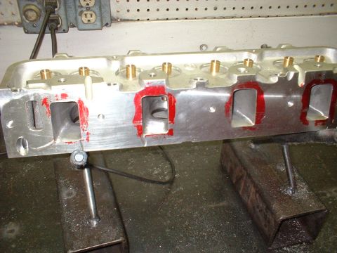 1968 Ford Galaxie - Close-up of an engine cylinder head with ports prepared for installation.