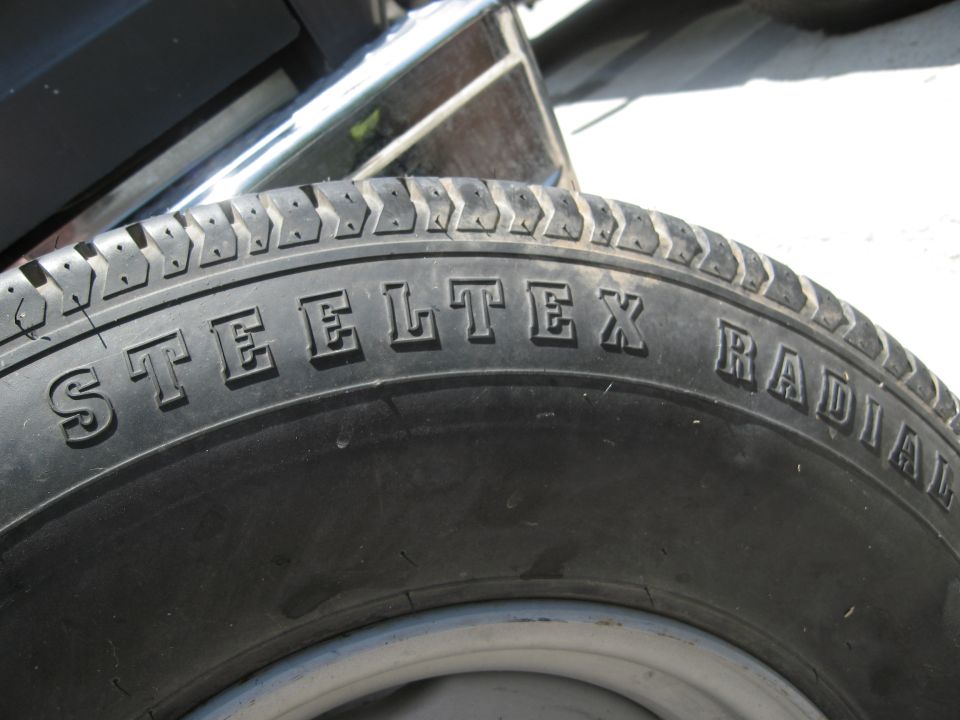 STEELTEX RADIAL tire sidewall with tread detail visible
