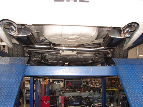 1992 Ford Taurus - Aftermarket exhaust system installed on a vehicle, viewed from below.