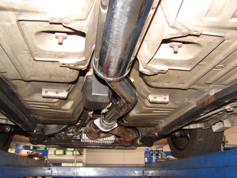 1992 Ford Taurus - Undercarriage of a vehicle, focusing on the exhaust system and chassis components.