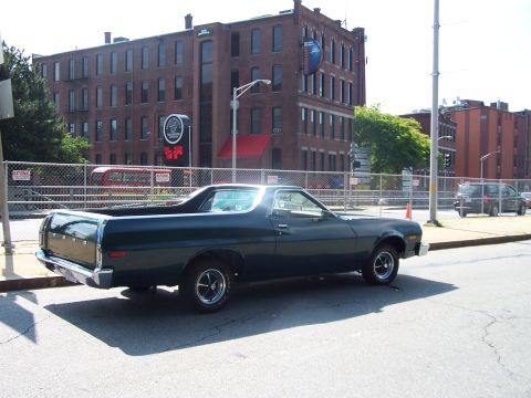 1975 Ford Ranchero - This 1975 Ford Ranchero is seen parked on a city street with a brick building in the background.