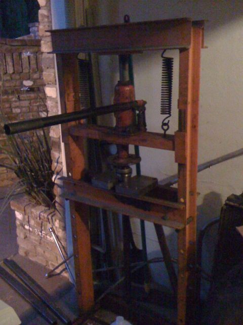 1989 Ford Bronco - This hydraulic press appears to be a vintage piece of equipment, likely used for industrial or mechanical tasks.