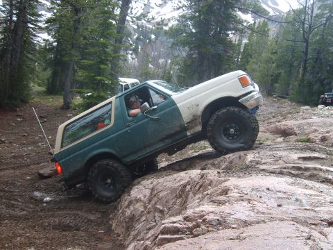 1989 Ford Bronco - This 1989 Ford Bronco navigates a challenging rocky terrain during an off-road excursion.