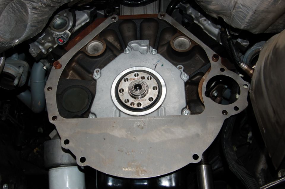 Engine block showing flywheel, starter mounting plate, and oil filter