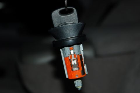 2007 Ford Mustang - Close-up of a vehicle's ignition cylinder and key, revealing the internal workings of the lock mechanism.