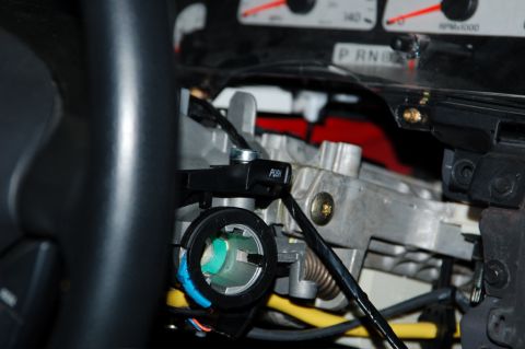 2007 Ford Mustang - Close-up view of the ignition cylinder and steering column components within a 2007 Ford Mustang.