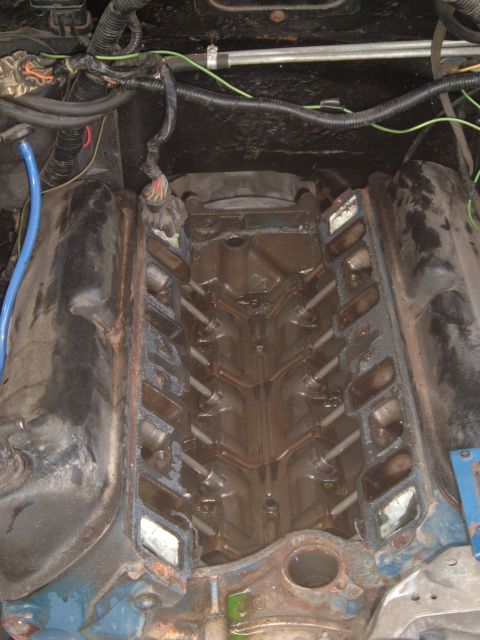 1990 Ford Ranger - The engine block is visible with the intake manifold removed, revealing the internal components.